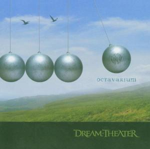 Dream Theater Albumcover mit silbernen Kugeln, grünen Hügeln und blauem Himmel mit Vögeln.