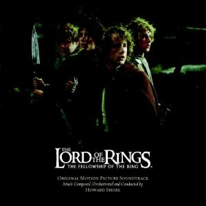 Filmcover: Vier Männer in einem Wald, Text 'The Lord of the Rings: The Fellowship of the Ring'.