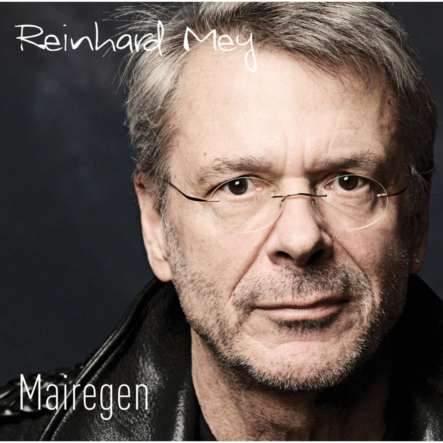 Reinhard Mey Albumcover. Er trägt eine Brille und schaut in die Kamera. Der Albumtitel steht unten.