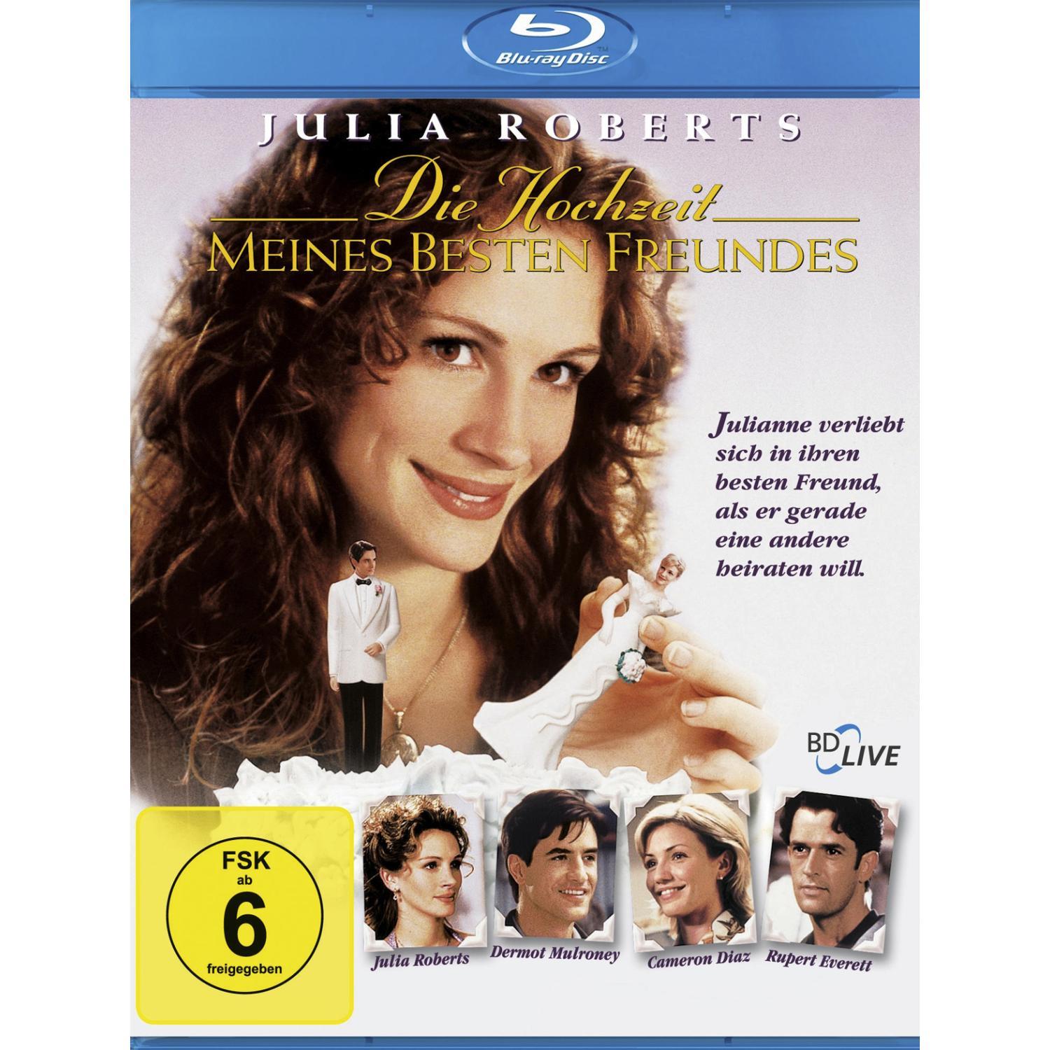 Filmcover für 'Die Hochzeit meines besten Freundes'. Julia Roberts lächelt, mit einer Kuchenfigur. Andere Schauspieler unten.