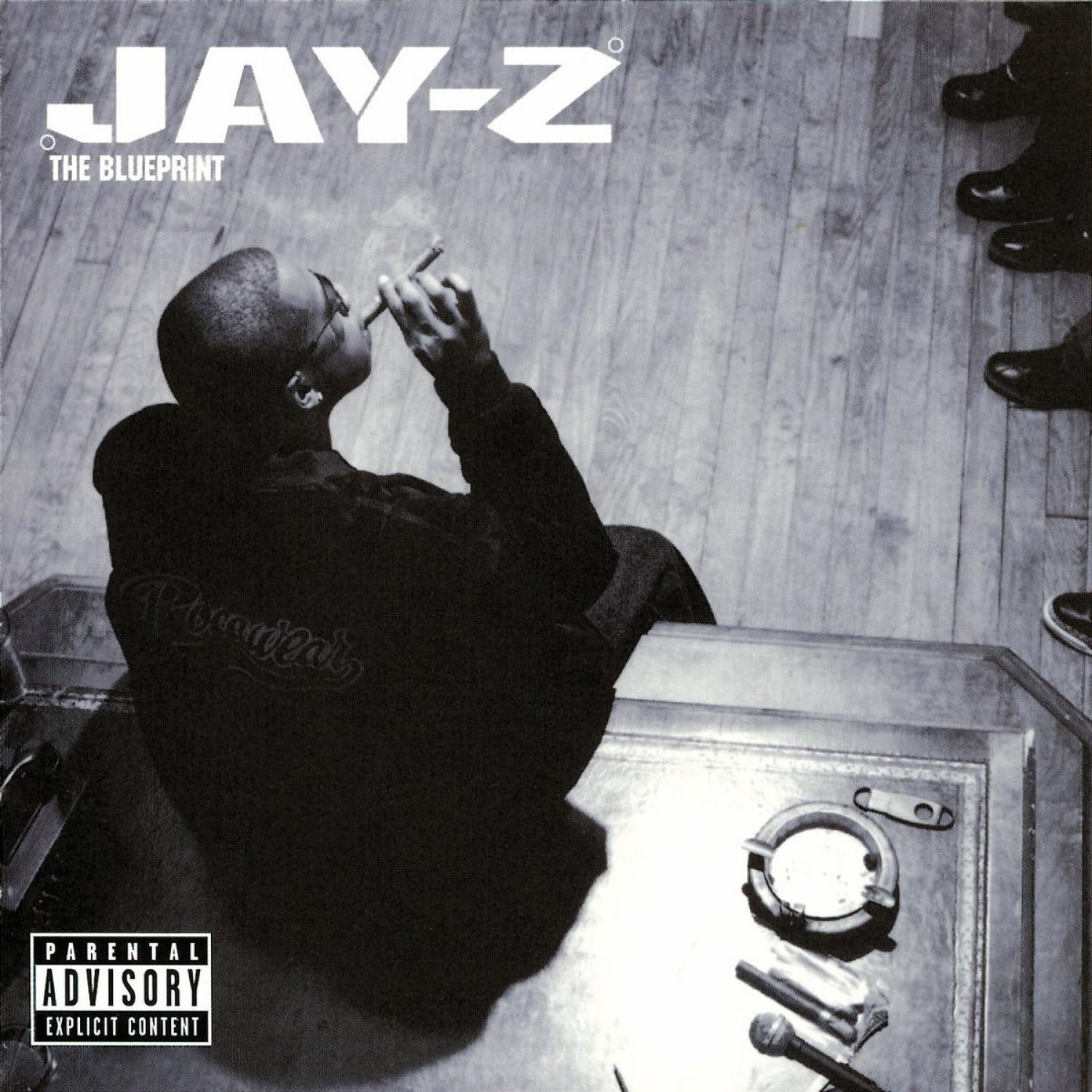 Jay-Z Albumcover, Schwarz-Weiß-Bild. Jay-Z raucht Zigarre, sitzt.