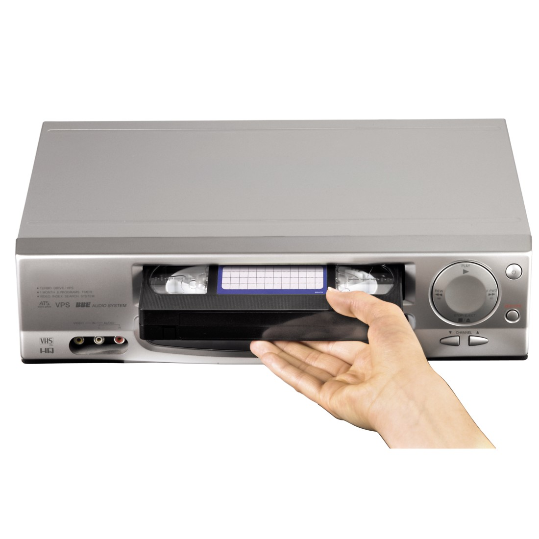 VHS player: Silver machine with a hand inserting a tape. Buttons visible on the front.
