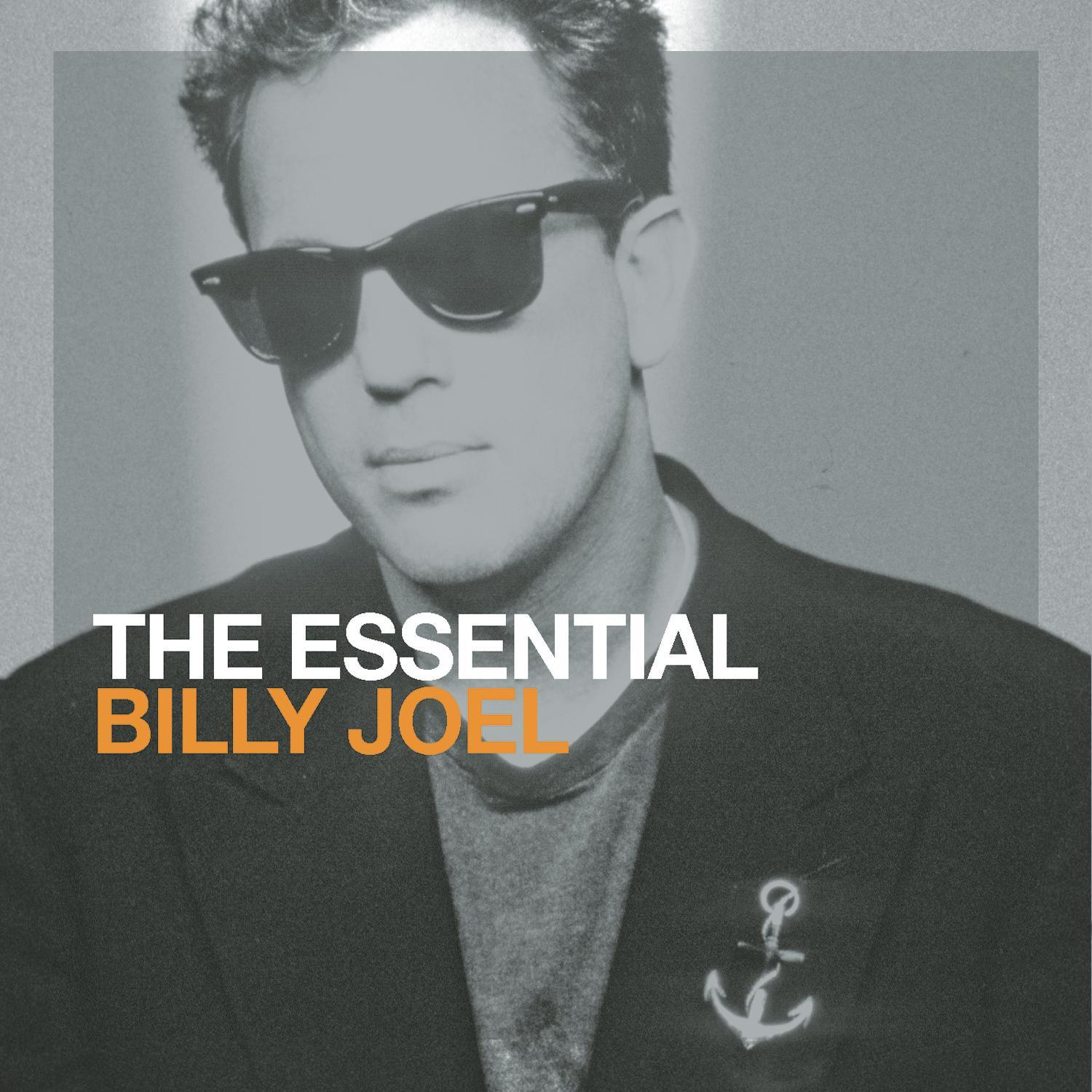 Pochette d'album de Billy Joel avec des lunettes de soleil, fond gris.