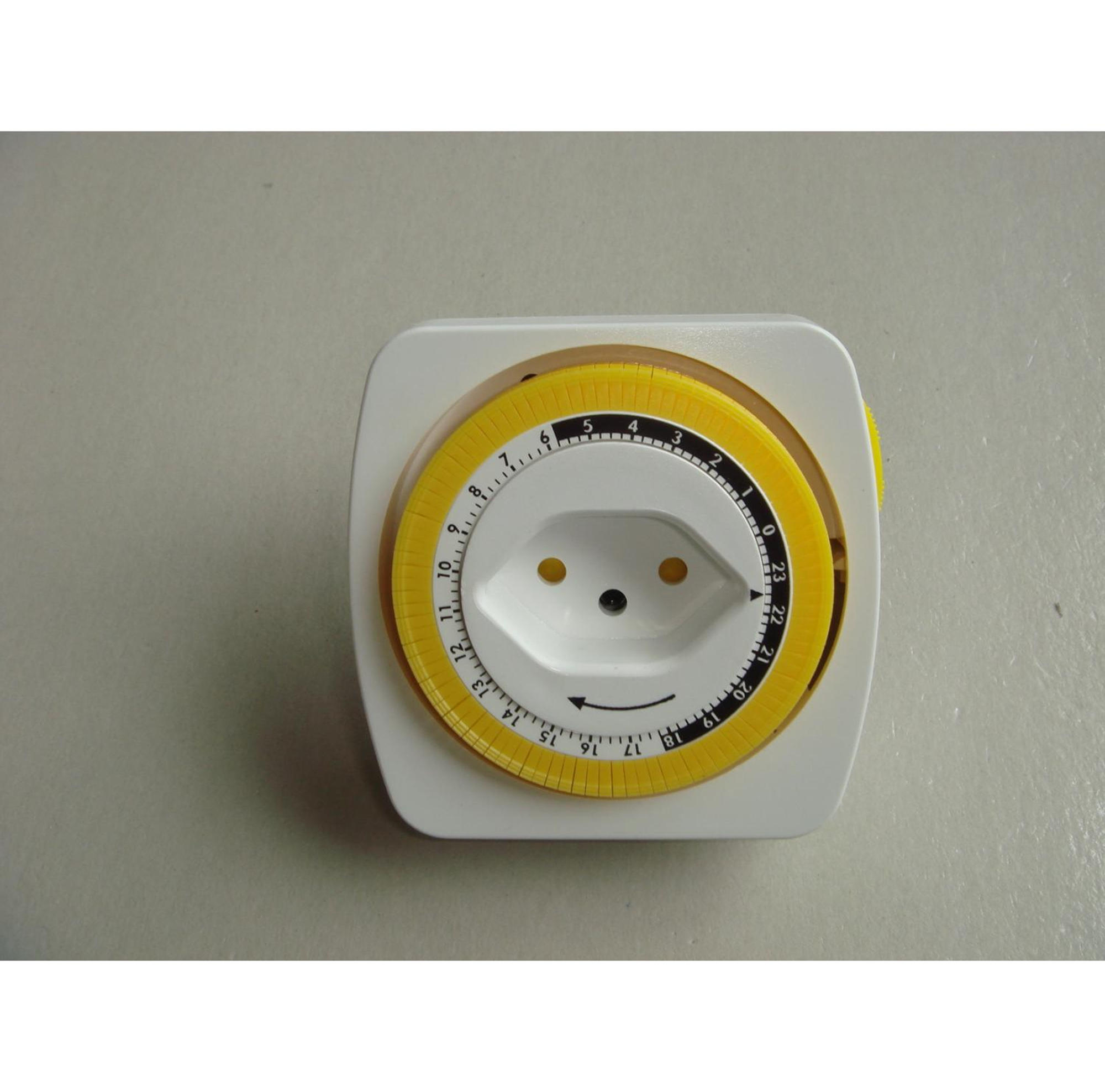 Ein Timer mit gelbem Zifferblatt und weißem Rahmen.