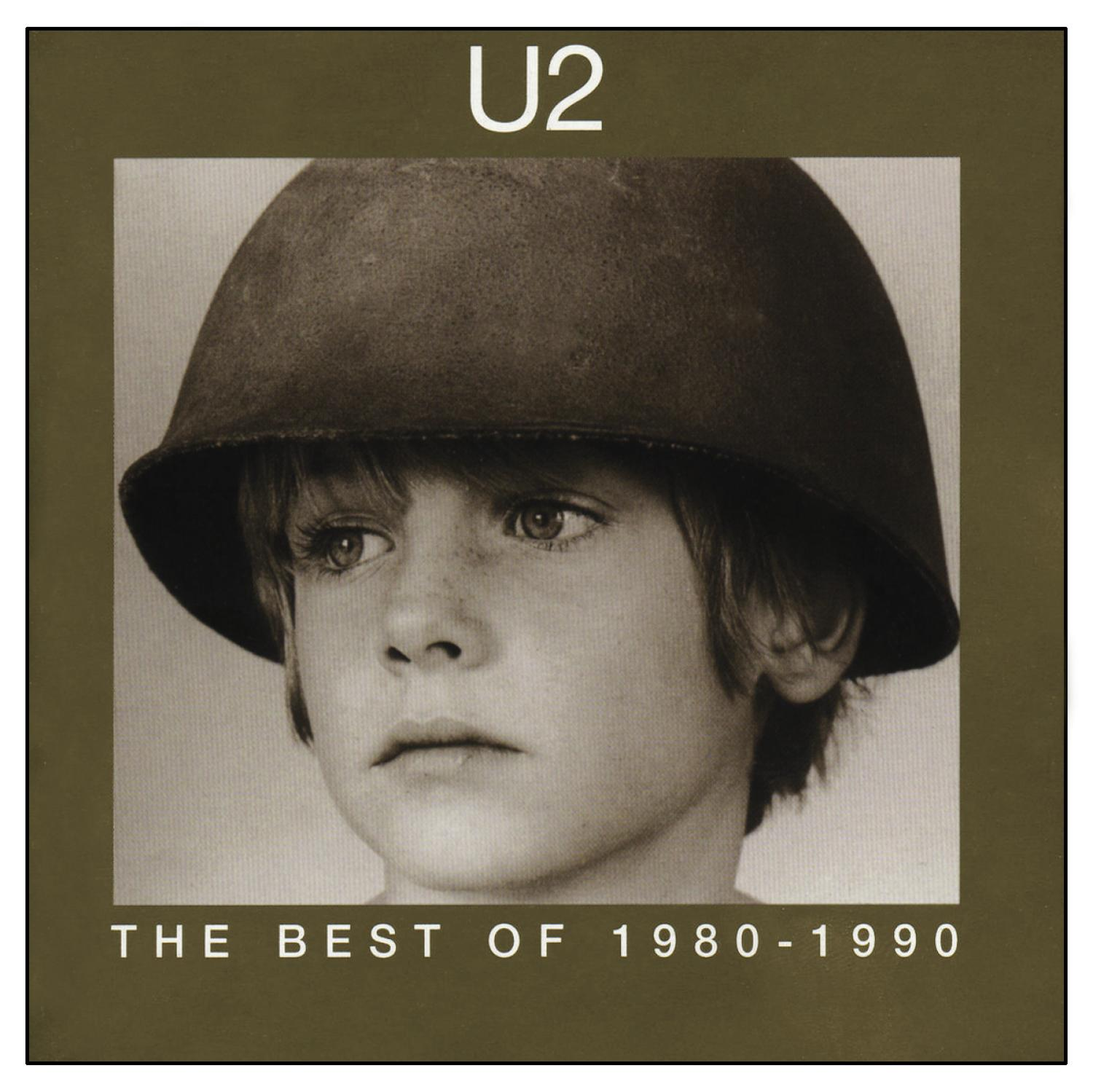 U2-Albumcover, ein junger Junge mit Helm, Text 'The Best of 1980-1990'.