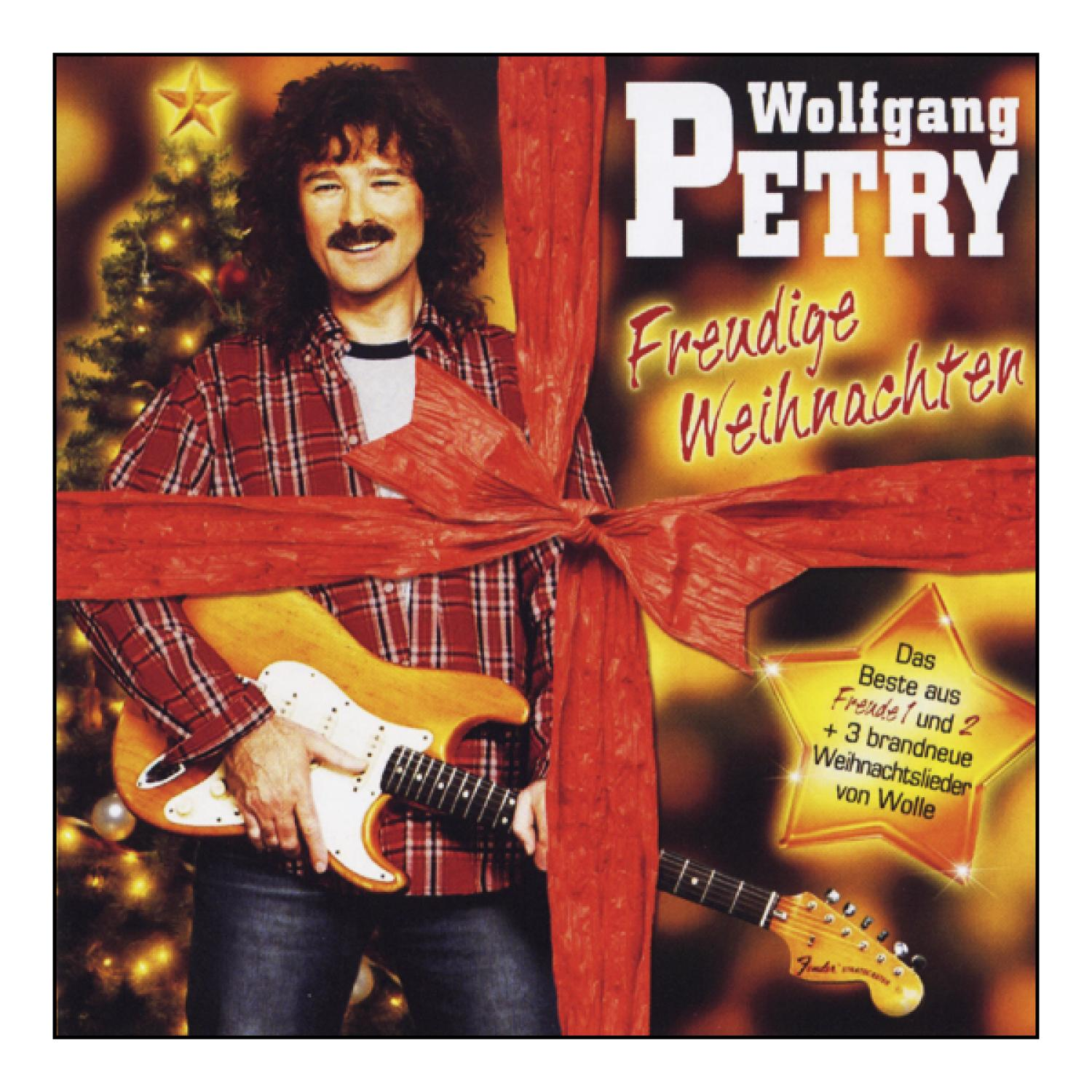 Wolfgang Petry Weihnachtsalbumcover. Mann mit Gitarre, rotem Band, Weihnachtsbaum und Text.