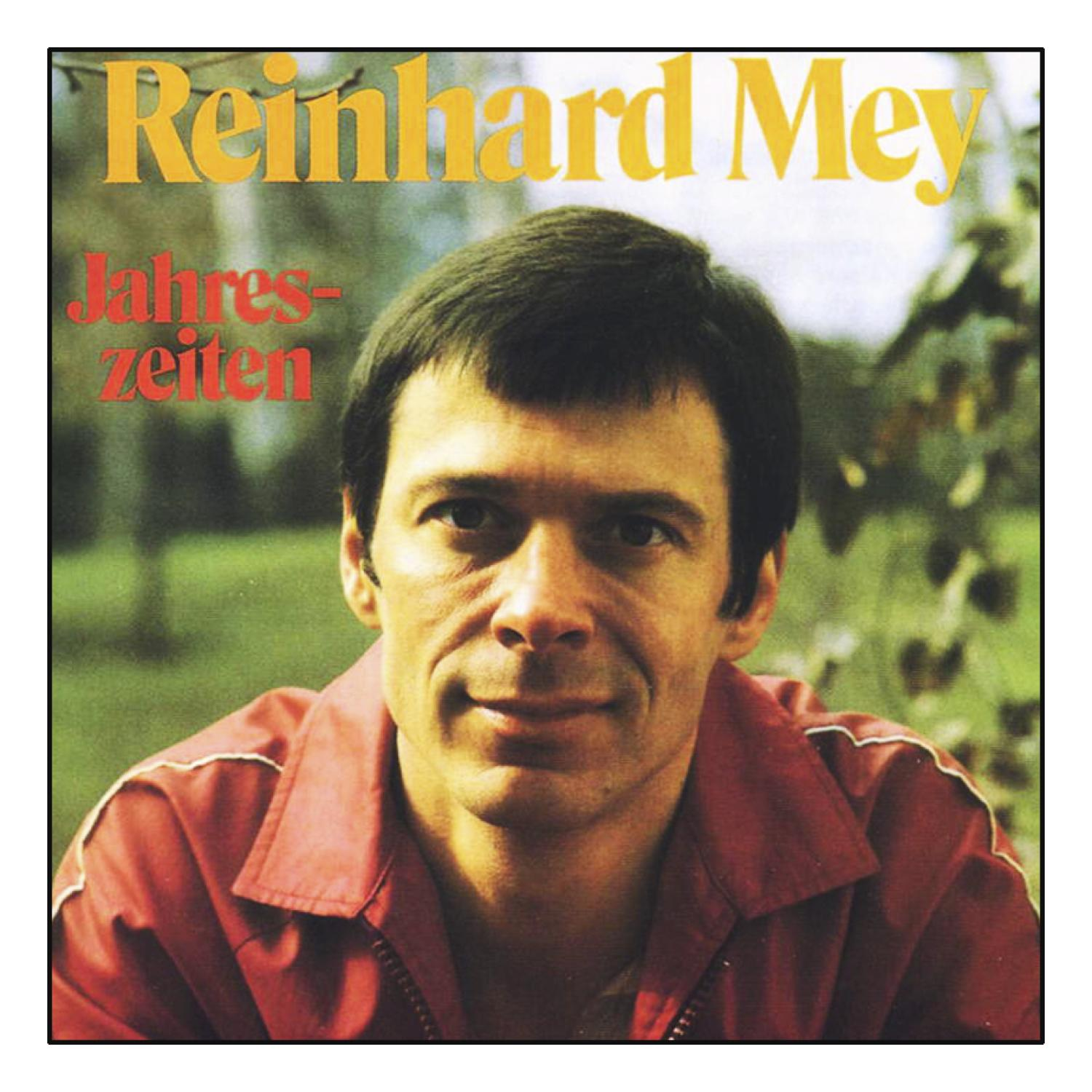 Albumcover mit einem Mann im roten Hemd, Text in Gelb und Rot.