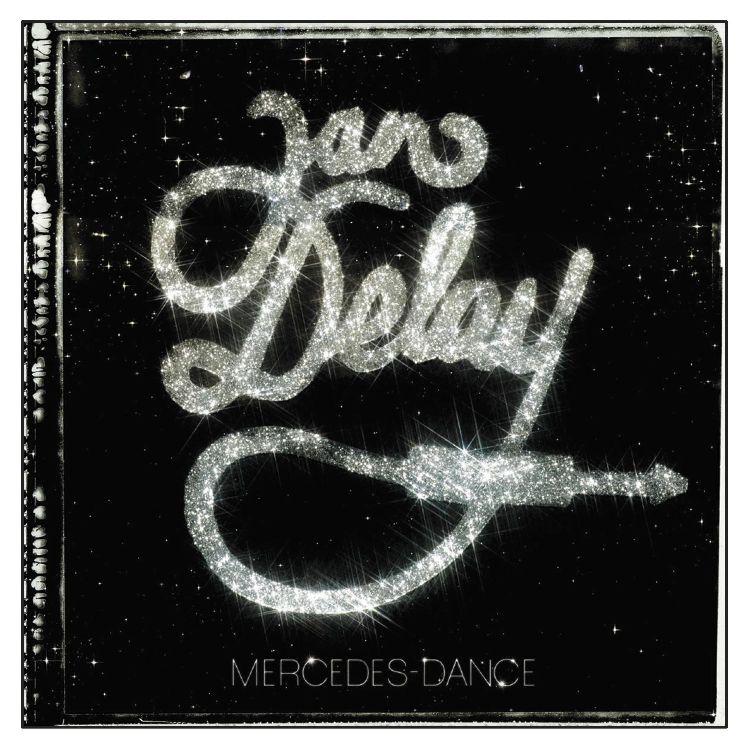 Albumcover mit dem Namen 'Jan Delay' in glitzernden Buchstaben und einem glitzernden Kabelanschluss auf schwarzem Hintergrund.