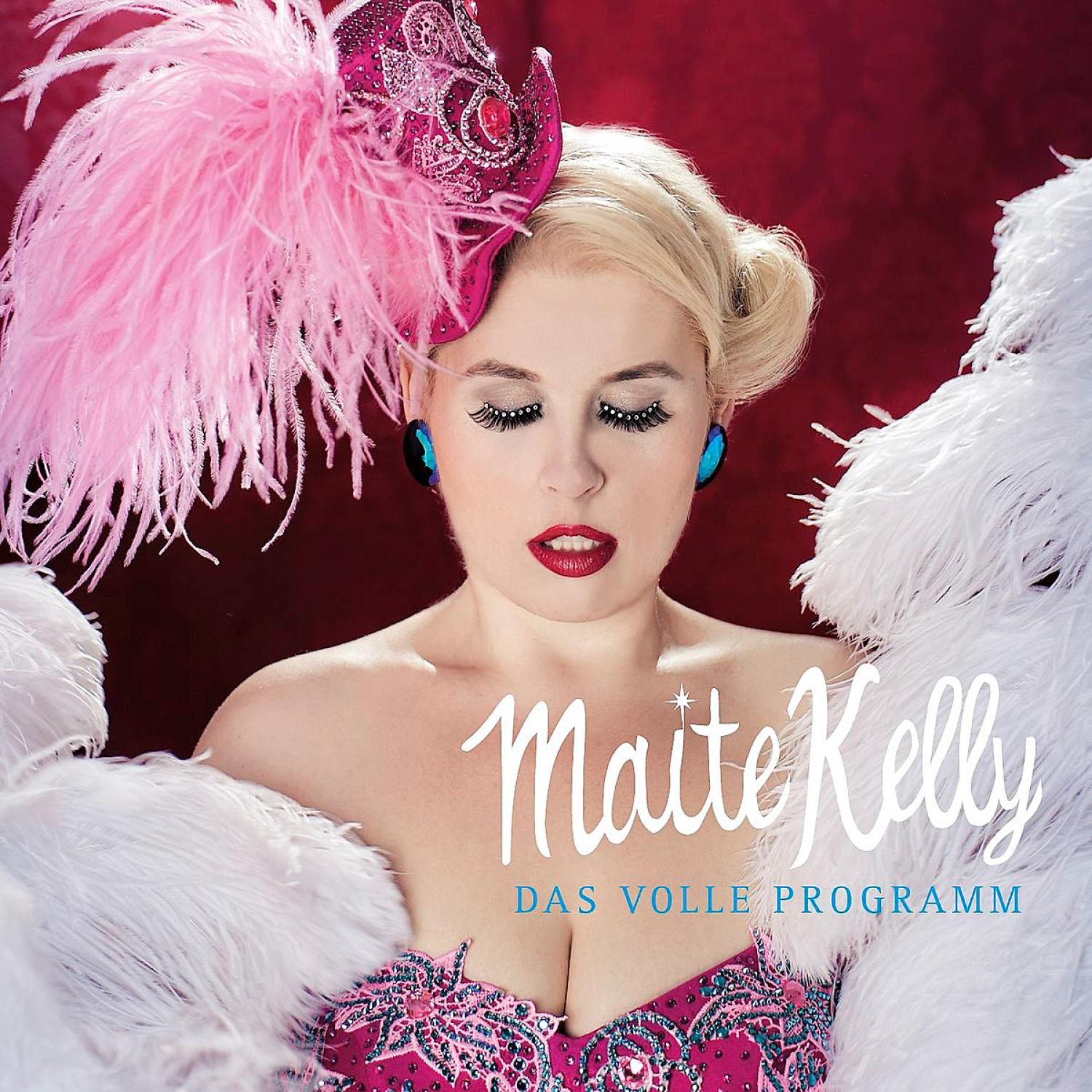Albumcover von Maite Kelly. Eine Frau mit Federn und pinkem Kleid.