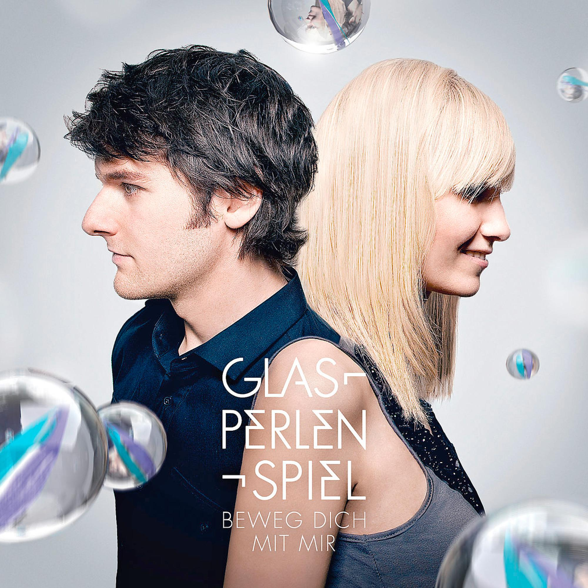 Albumcover eines Mannes und einer Frau mit Blasen und Text auf hellem Hintergrund.