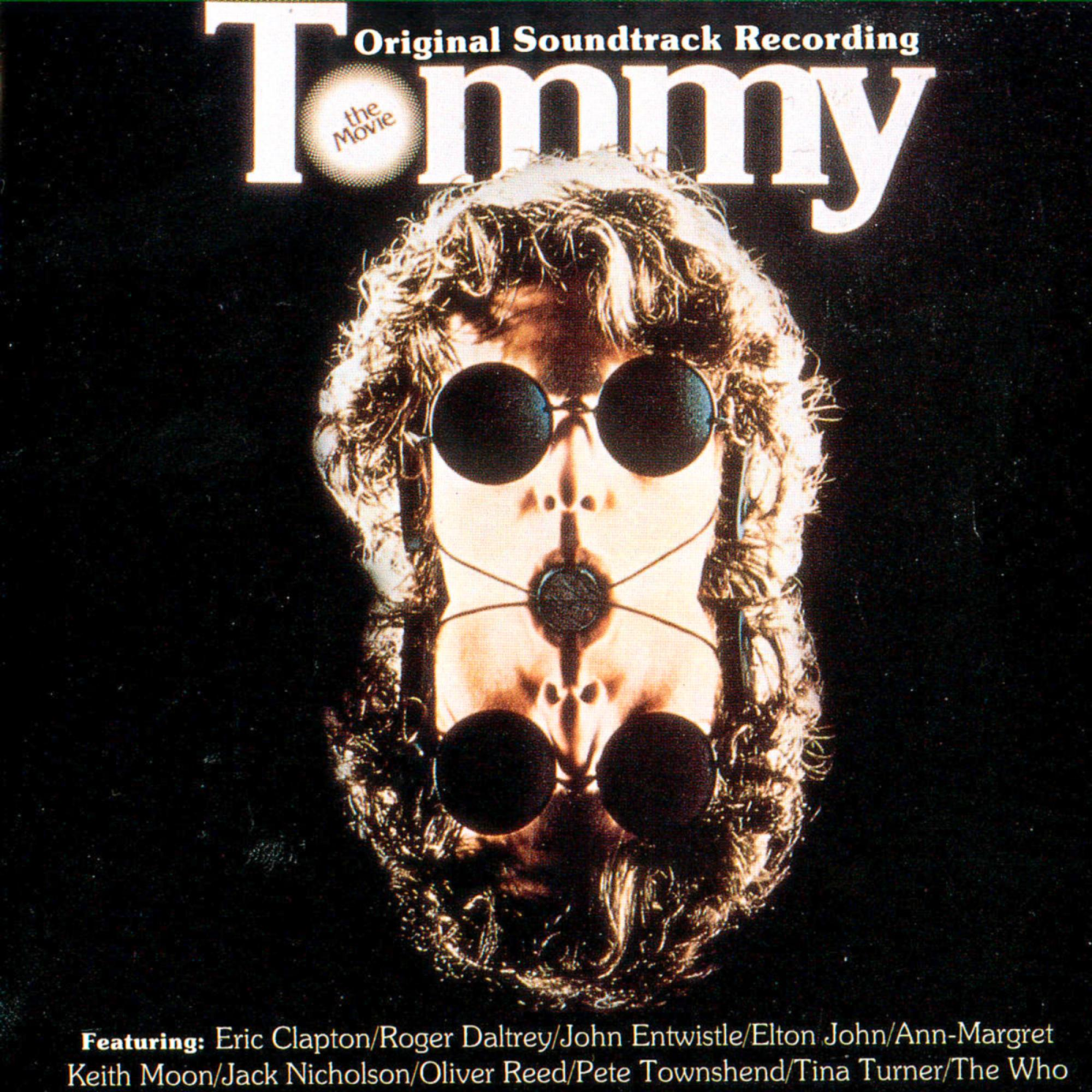 Albumcover mit einem Gesicht mit Sonnenbrille, mit dem Text 'Tommy' und Künstlergutschriften.