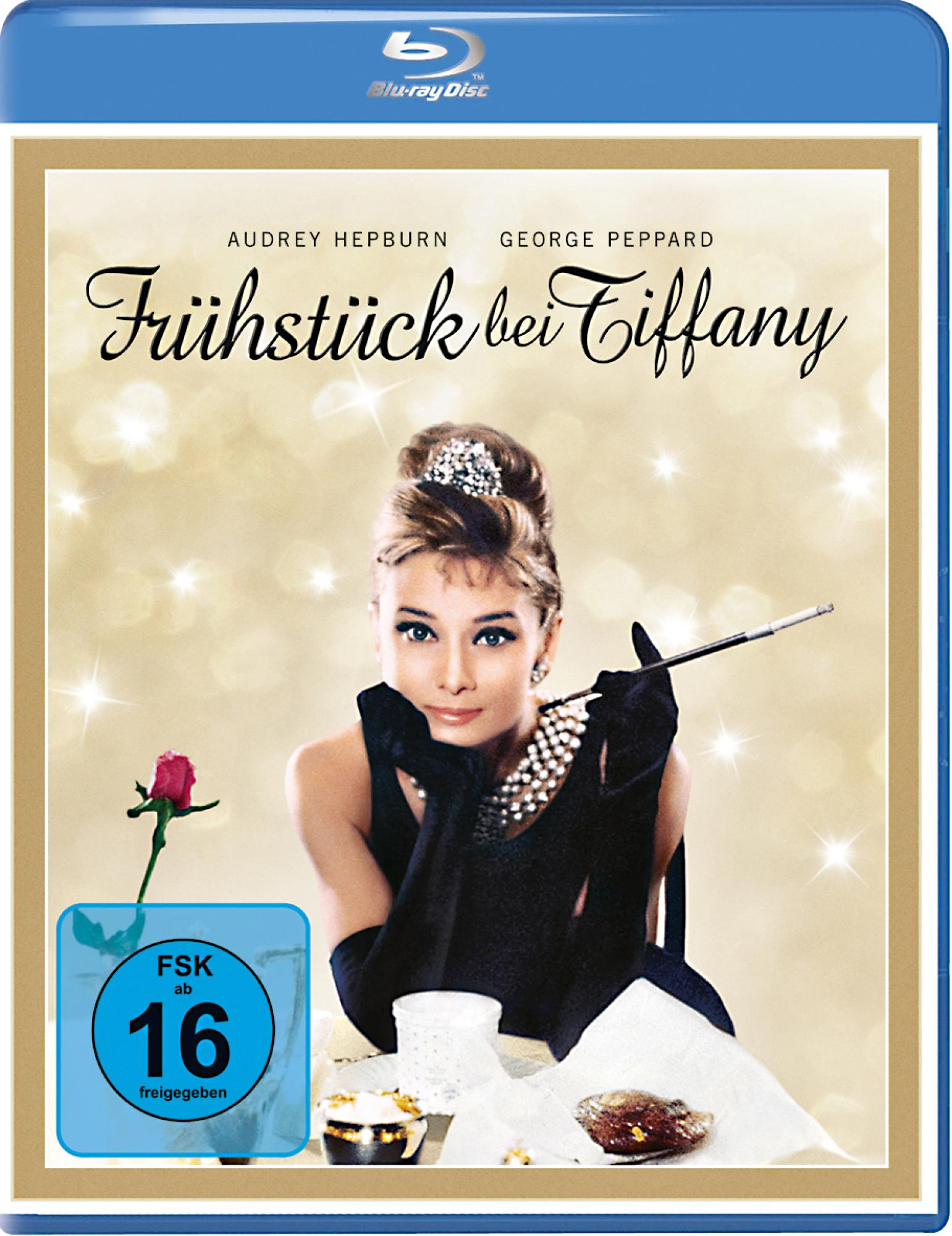 DVD-Cover mit Audrey Hepburn in einem schwarzen Kleid und George Peppard. Der Titel lautet Frühstück bei Tiffany. Blu-ray Disc.