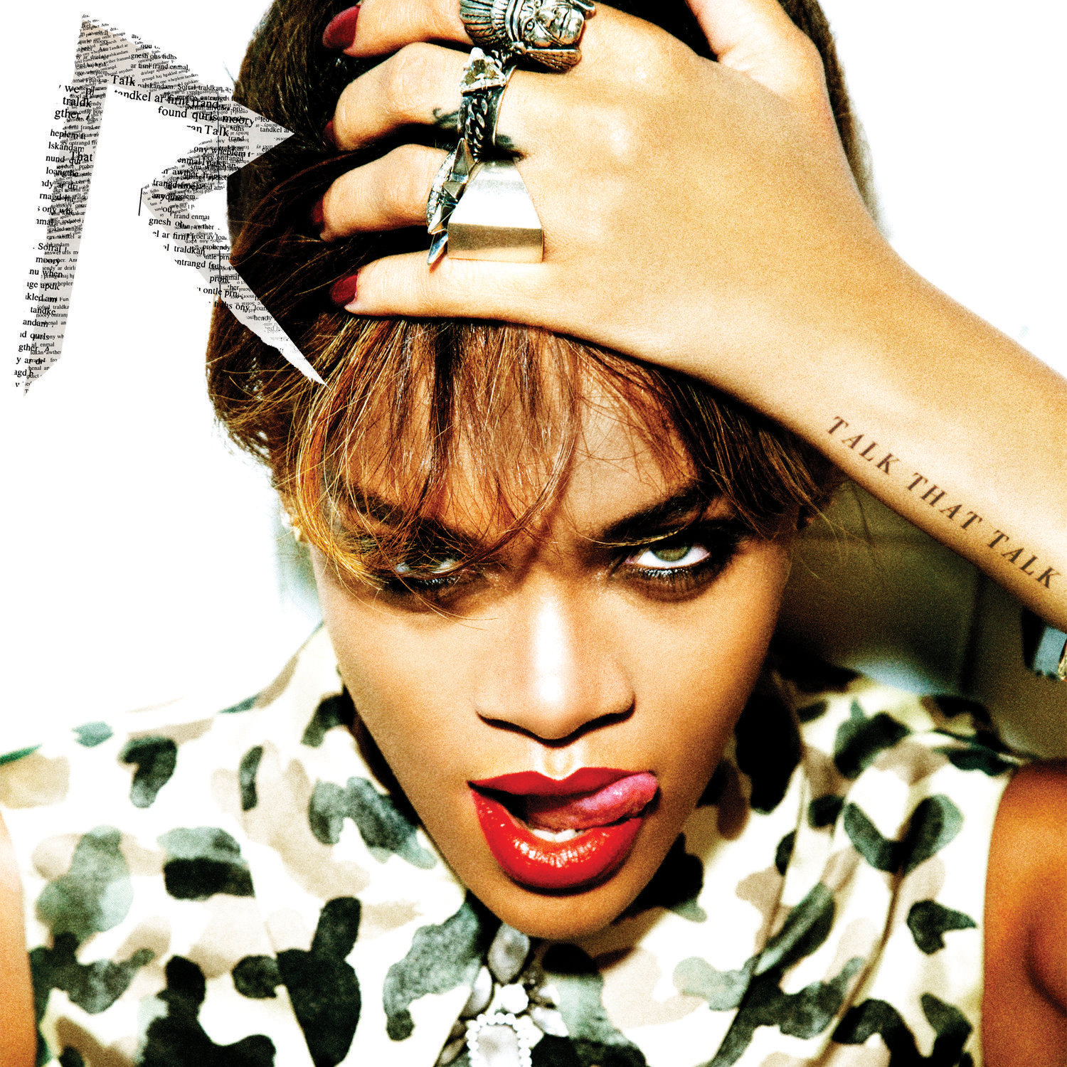 Rihanna Albumcover. Sie blickt mit rotem Lippenstift und herausgestreckter Zunge in die Kamera.