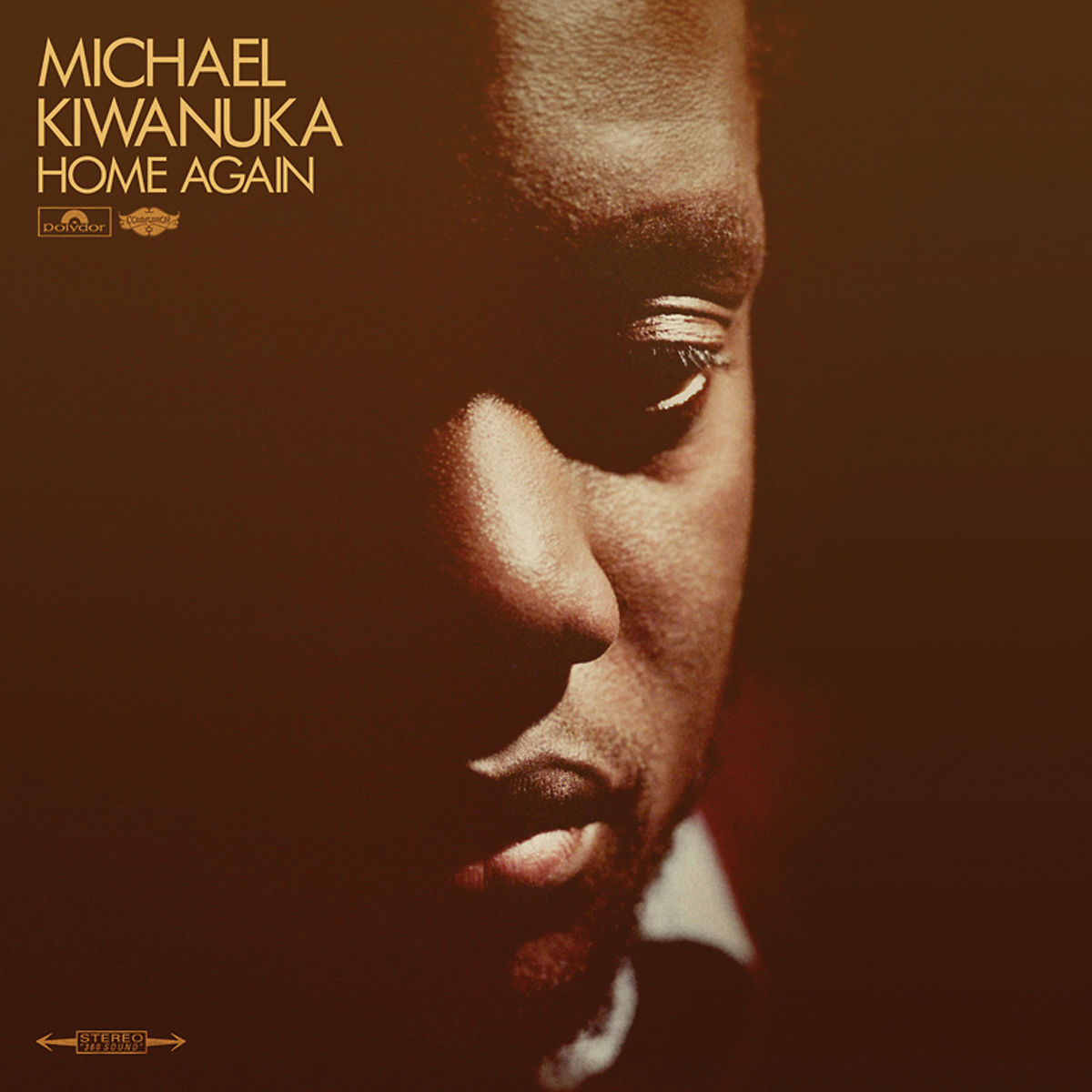 Michael Kiwanuka Albumcover: Nahaufnahme seines Gesichts in warmen Brauntönen.