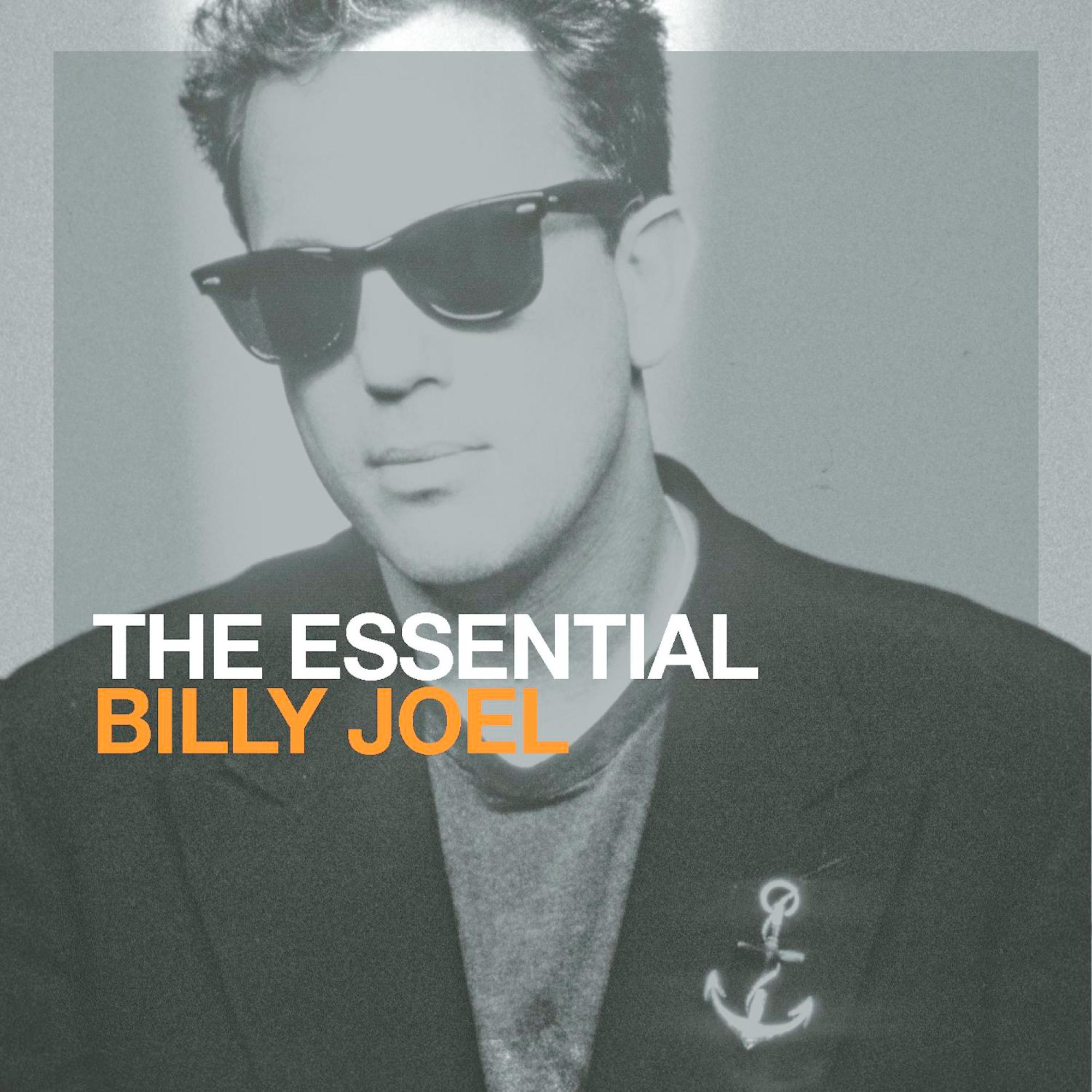 Billy Joel mit Sonnenbrille, Albumcover. Text: 'The Essential Billy Joel'. Ankeremblem rechts.