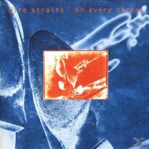 CD-Cover mit einem blauen und orangefarbenen abstrakten Design. Oranges Rechteck in der Mitte mit Figuren.