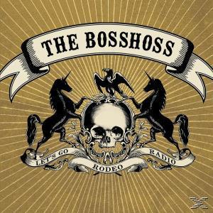 The BossHoss Albumcover. Totenkopf mit Einhörnern, Banner, Let's Go Rodeo Radio, goldener Hintergrund.