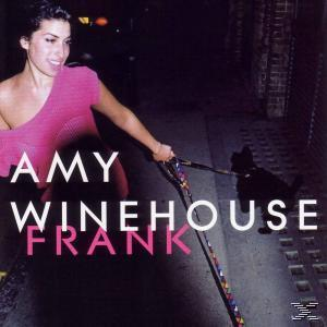 Albumcover von Amy Winehouse, die eine Leine mit einem Hund hält. Pinkes Kleid, dunkler Straßenhintergrund, Albumtitel unten.