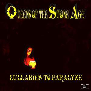 Albumcover. Person hält ein Licht in einem dunklen Raum. Text: Lullabies to Paralyze.