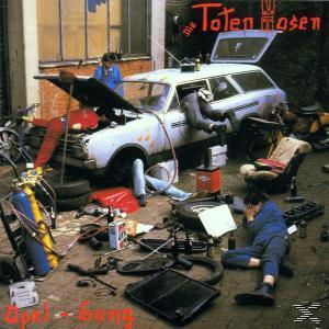Die Toten Hosen Albumcover. Leute arbeiten an einem Auto. Werkzeuge sind überall. Viel Chaos.