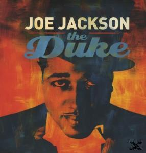 Joe Jackson "The Duke" című albumának borítója. Egy kalapos férfi portréja, felül és alul szöveggel.
