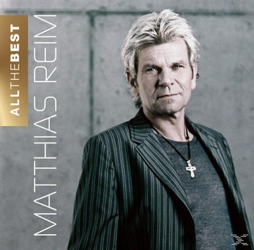 Matthias Reim Albumcover. Mann im Anzug, mit Kreuzkette und Text.