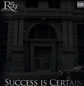 Albumcover von 'Success is Certain' von Royce 5'9. Die Detroit Savings Bank ist im Hintergrund. Ein schwarzes Auto ist rechts.