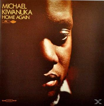 Albumcover, das Gesicht eines Mannes im Schatten. Text: Michael Kiwanuka, Home Again. Brauner Hintergrund.