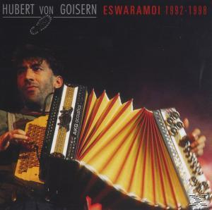 Mann spielt Akkordeon. Roter und schwarzer Hintergrund, Text 'Hubert von Goisern'.