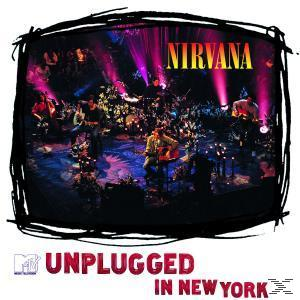 Nirvana MTV Unplugged album borítója. A zenekar a színpadon játszik, sötét, elmosódott háttérrel.