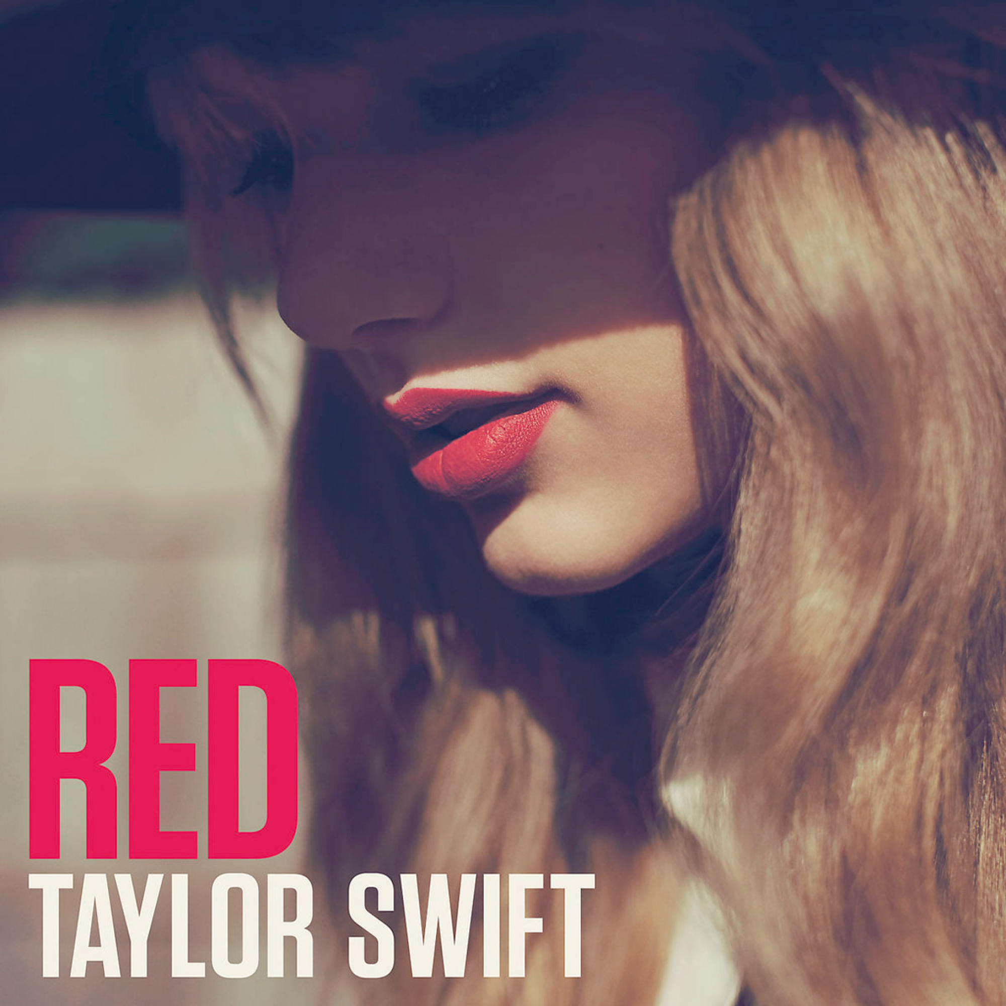 Album cover. Taylor Swift Red. Close-up of woman's face with red lips. Red text.
