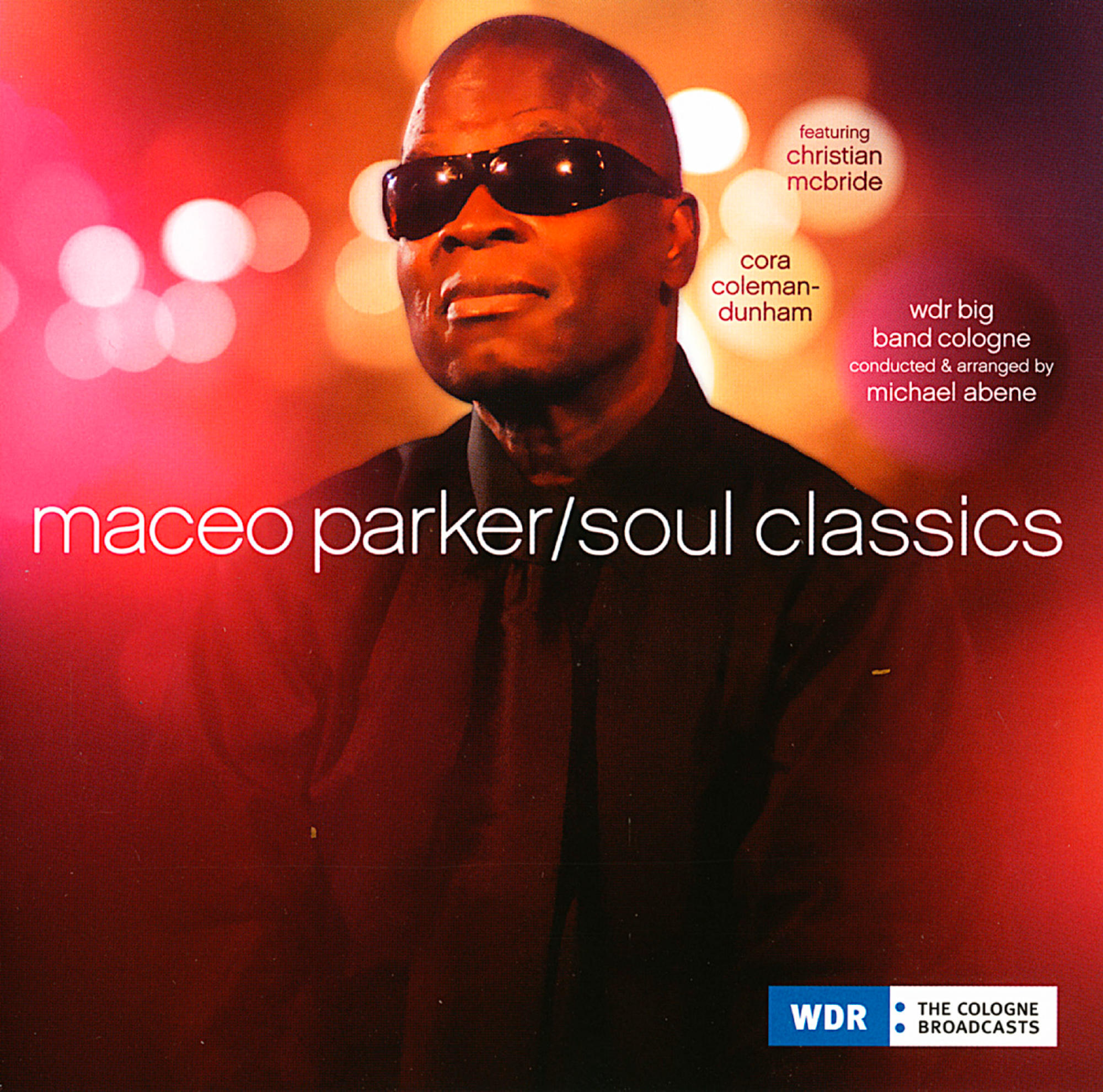 Maceo Parker mit Sonnenbrille, roter und rosa verschwommener Hintergrund, Albumcover.