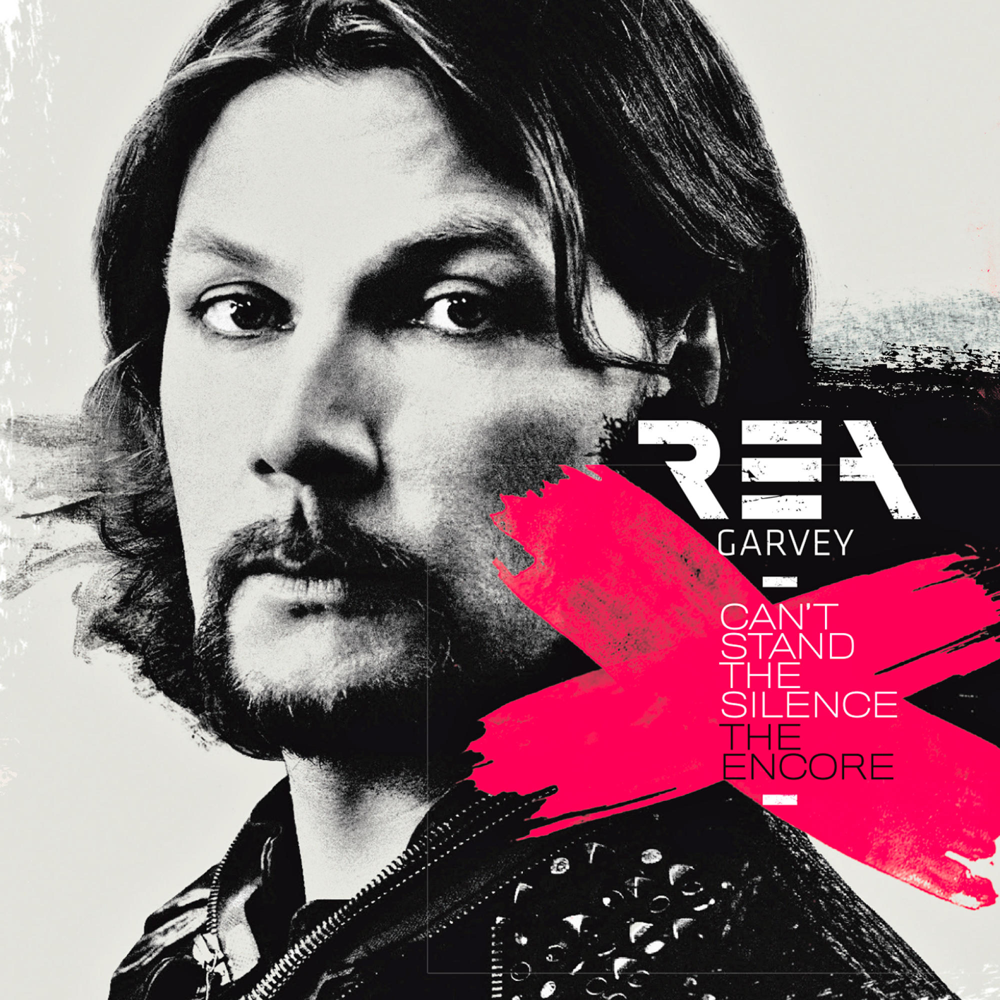 Rea Garvey Albumcover. Mann mit pinkem X und Albumtitel.