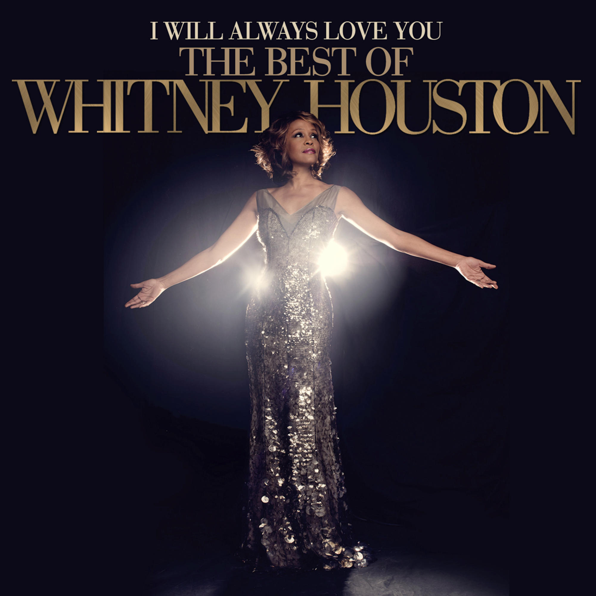 Pochette d'album avec Whitney Houston en robe argentée, bras tendus. Texte doré : 'I Will Always Love You'.