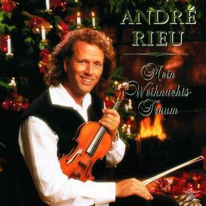 André Rieu Albumcover. Er hält eine Geige vor einem Weihnachtsbaum und einem Kamin.
