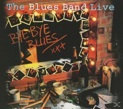 Albumcover: The Blues Band Live. Ein Spiegel mit Fotos und Text. Flaschen und Tassen auf einem Tisch.