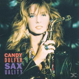 Candy Dulfer Albumcover, hält ein Saxophon, trägt eine schwarze Jacke, mit Text und dunklem Hintergrund.