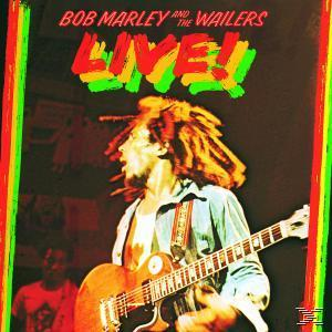 Bob Marley auf der Bühne singt, Gitarre spielt, mit rot-gelb-grünem Rand.