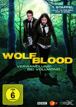 DVD-Cover für 'Wolfblood'. Zwei Personen vor Bäumen, ein Wolfschatten ist sichtbar.