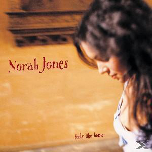 Albumcover von Norah Jones. Zeigt ihr Gesicht und den Albumtitel. Der Hintergrund ist orange.