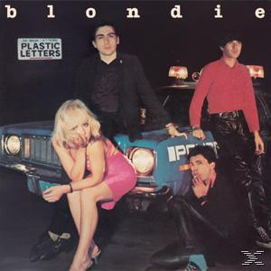 Albumcover mit einer blonden Frau und drei Männern mit einem Polizeiauto im Hintergrund. Text: Blondie, Plastic Letters.