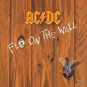 Albumcover: Holzmaserung mit Auge und Fliege. Titel "Fly on the Wall".