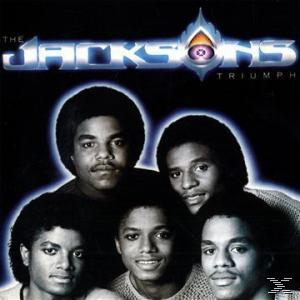 Albumcover 'Triumph' von The Jacksons. Fünf Männer in einem Gruppenfoto vor blauem Hintergrund.
