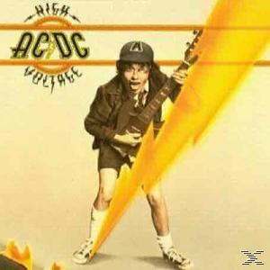 Az AC/DC High Voltage albumának borítója. Egy gitáros fiút sárga villám csap meg.