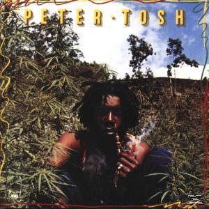 Albumcover mit Peter Tosh, der eine Pfeife raucht, umgeben von Pflanzen.