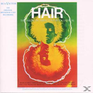 Albumcover für das Musical 'Hair' mit farbenfrohem Gesicht und Text.