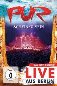 Ein DVD-Cover mit einer Bühne und vielen Leuten, die sich die Show ansehen.