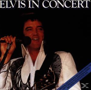 Albumcover mit Elvis im Konzert, singend in ein Mikrofon, schwarzer Hintergrund und Text.