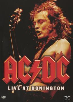 AC/DC Live at Donington DVD-Cover. Mann mit langen Haaren spielt Gitarre auf der Bühne.