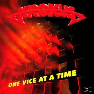 Albumcover von Krokus. Roter Text 'One Vice at a Time'. Schwarzer und roter abstrakter Hintergrund.